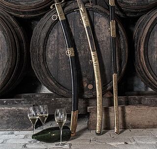 Andre Clouet-sværd og halshugget champagneflaske