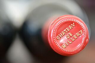 Kapsel med vin på Chateau de Millery